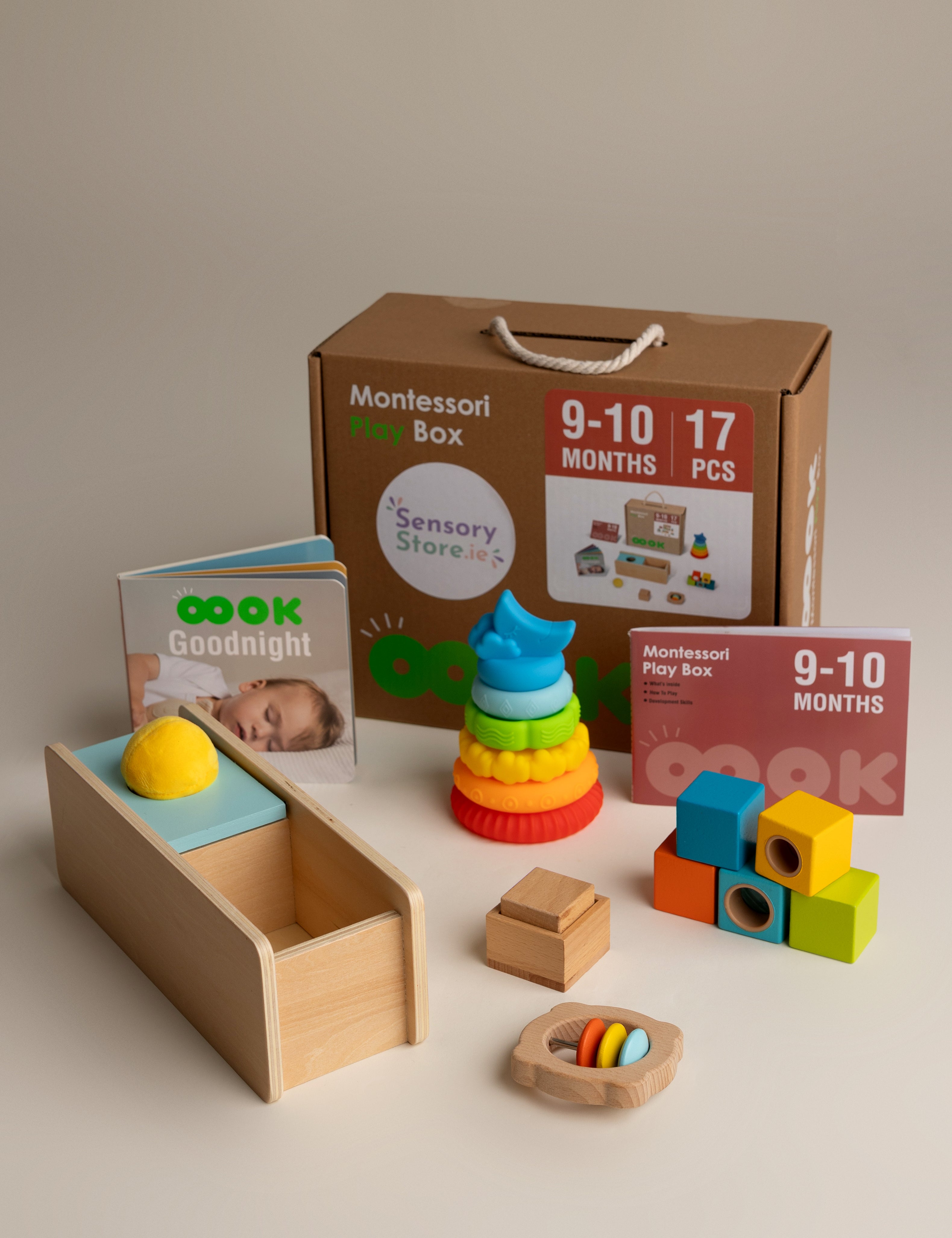 Montessori toy box aged 9-10 months with educational toys and materials on a neutral background
