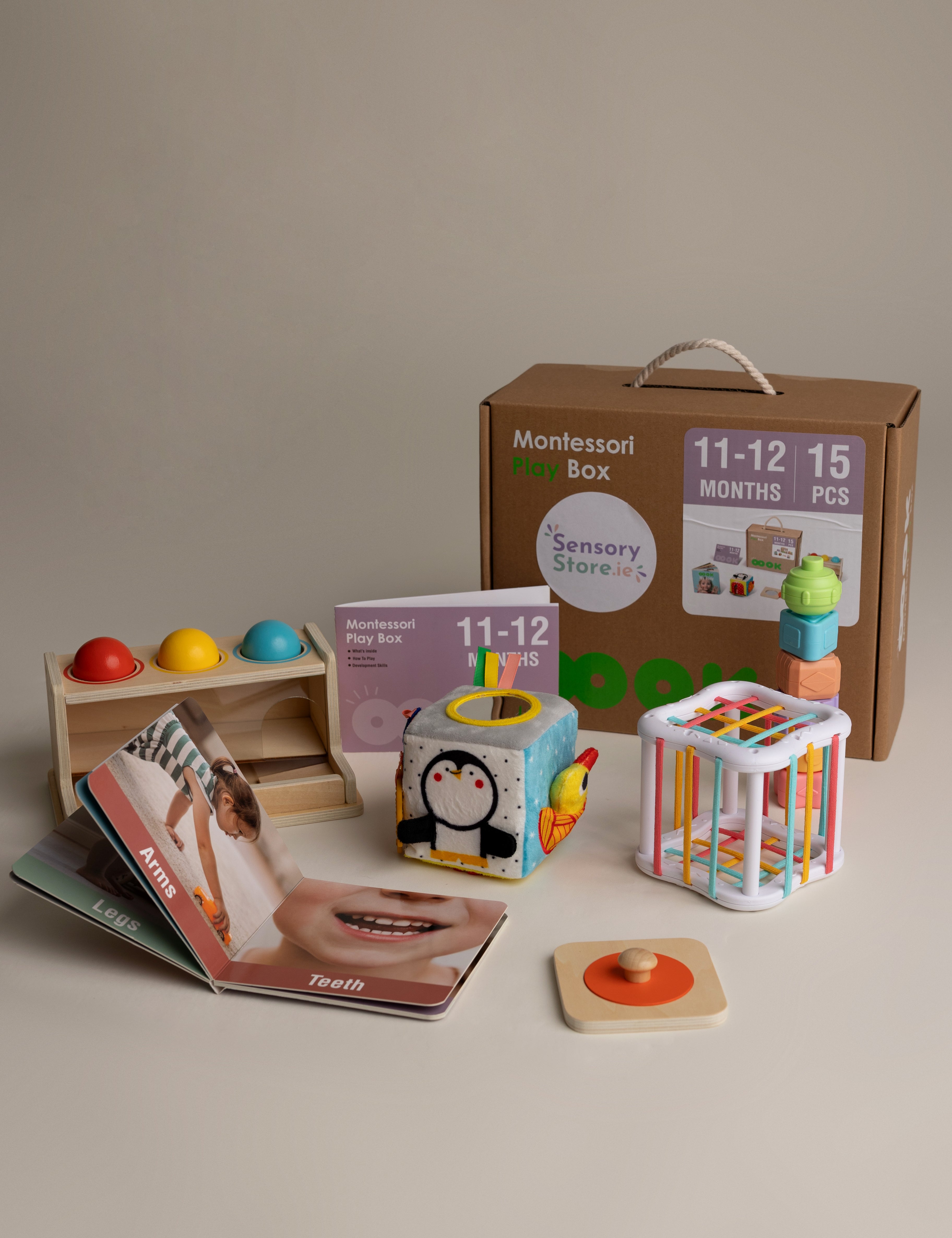 Montessori toy box with educational toys and materials on a neutral background