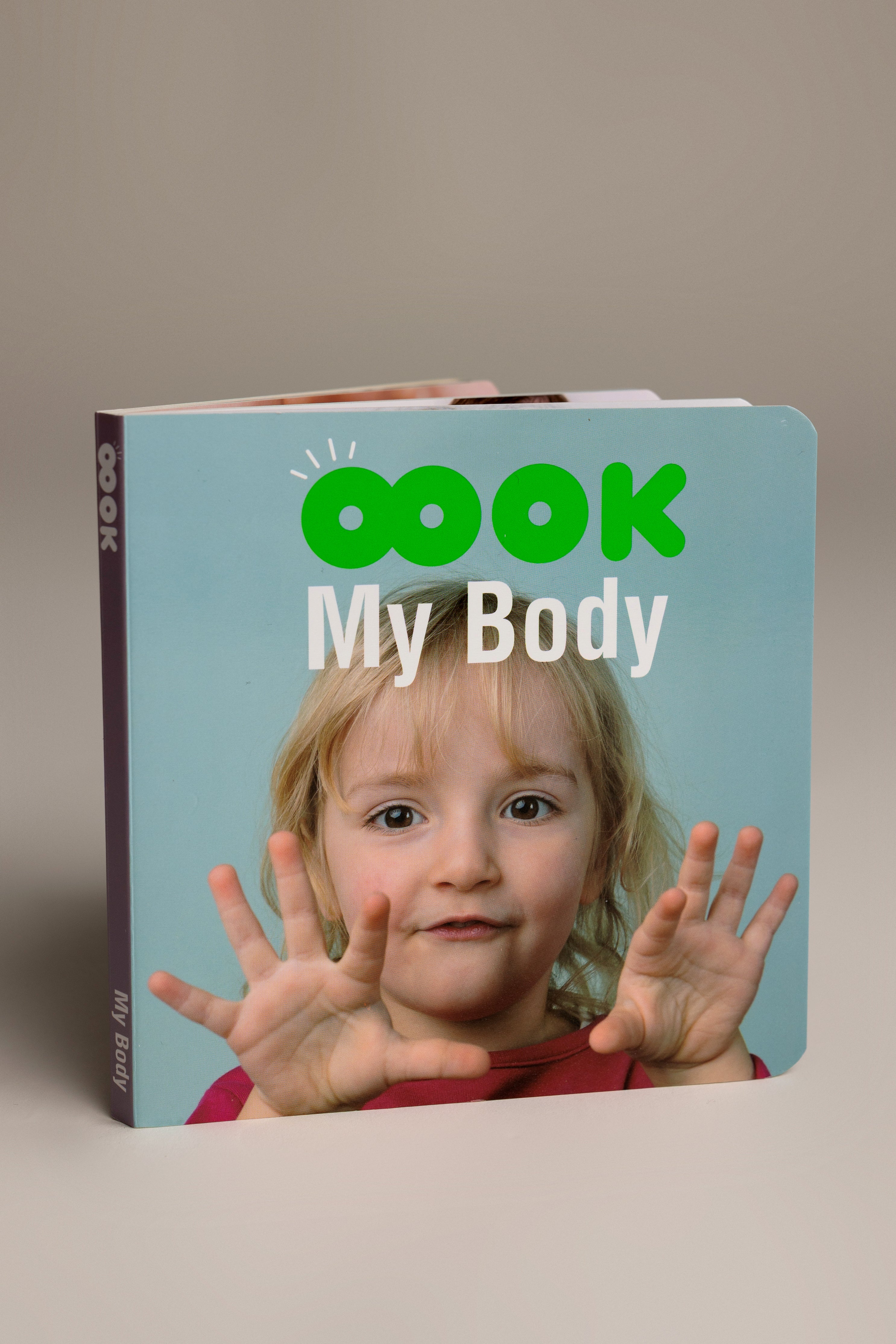 Book titled 'My Body' with a child on the cover against a beige background